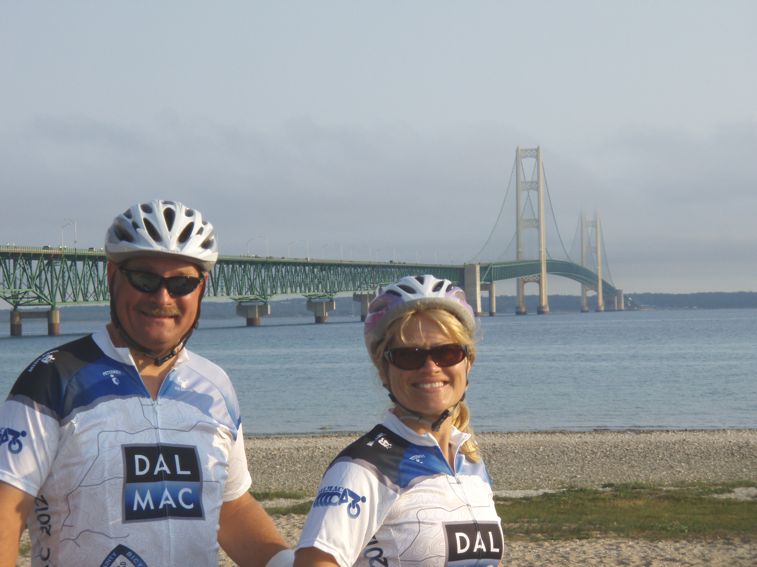 Andy and Theresa with the huge bridge they just crossed behind them